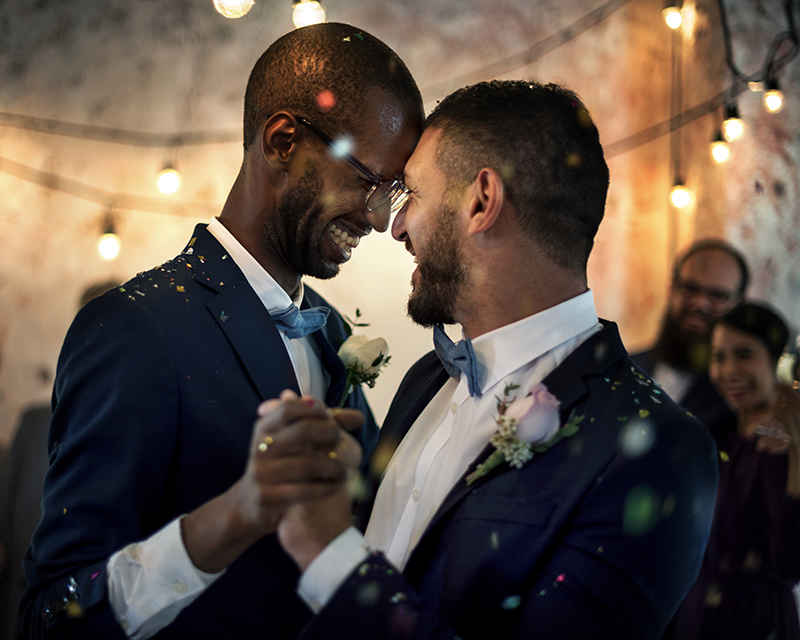 Two men dancing at a wedding - LGBTQ Therapist
