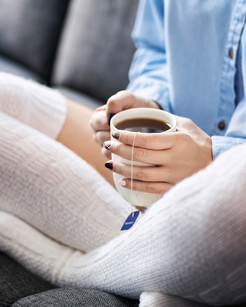 Teenager holding a cup of tea for adolescent counseling